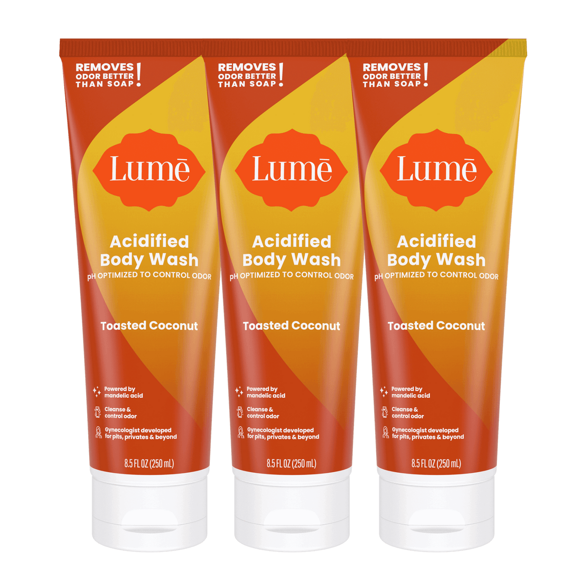 Three orange tubes of body wash in the scent Toasted Coconut